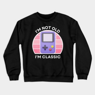 I'm not old, I'm Classic | Handheld Console | Retro Hardware | Vintage Sunset | Gamer girl | '80s '90s Video Gaming Crewneck Sweatshirt